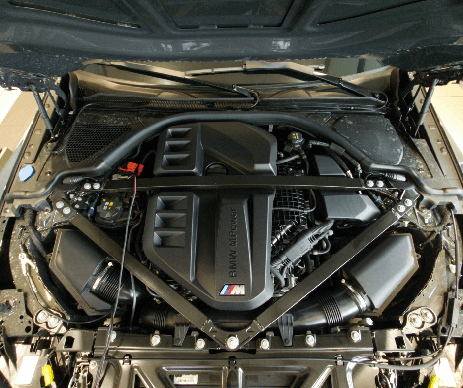 BMW M-series engine bay showcasing high-performance engine components and M badging