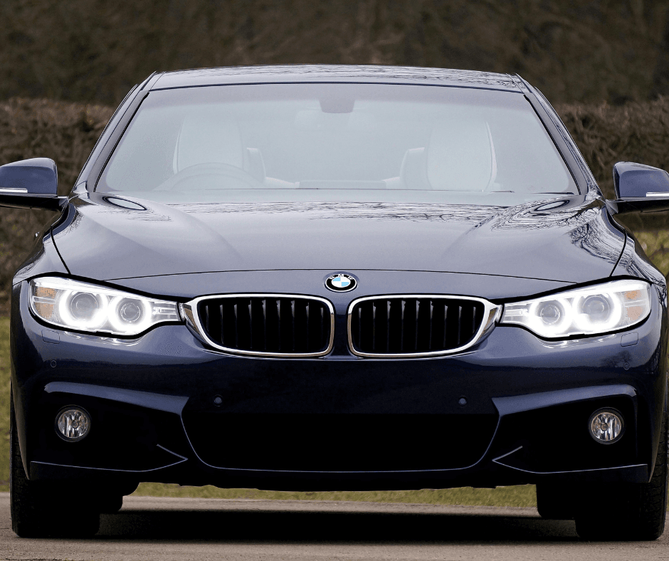 Front view of dark blue BMW 4-series with LED headlights and kidney grille