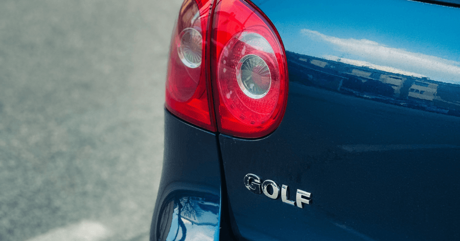 Blue Volkswagen Golf rear taillight and badge close-up detail